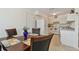 Open-concept kitchen flowing into the dining area, perfect for entertaining and everyday living at 711 6Th Ne St, Largo, FL 33770