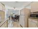 Kitchen area with a dining table set near the window, offering a casual eating space at 711 6Th Ne St, Largo, FL 33770