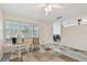 Living room featuring natural light from the windows and an open view into the adjacent dining room at 711 6Th Ne St, Largo, FL 33770