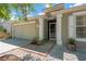 Inviting entrance featuring a screen door, brick-lined flower beds, and painted columns at 7705 Dragon Fly Loop, Gibsonton, FL 33534