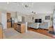 Open layout featuring the kitchen with granite counters and view to the living room at 7705 Dragon Fly Loop, Gibsonton, FL 33534