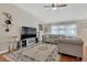 Spacious living room features vaulted ceilings, large windows, and an elegant area rug at 7705 Dragon Fly Loop, Gibsonton, FL 33534