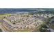 Aerial view of a cozy residential neighborhood with well-spaced homes and lush green spaces at 7939 Merchantville Cir, Zephyrhills, FL 33540