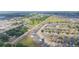 Aerial view of a Gathering-friendly neighborhood with tidy homes and green spaces at 7939 Merchantville Cir, Zephyrhills, FL 33540