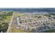 Aerial view of a well-planned residential community with tidy homes and landscaped yards at 7939 Merchantville Cir, Zephyrhills, FL 33540