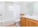Bathroom featuring a tub and vanity at 7939 Merchantville Cir, Zephyrhills, FL 33540