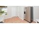 Stainless steel refrigerator in an eat-in kitchen featuring tile floors at 7939 Merchantville Cir, Zephyrhills, FL 33540