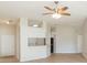 Bright living room featuring new floors, fan and neutral wall color at 7939 Merchantville Cir, Zephyrhills, FL 33540