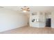 Spacious living room with abundant natural light, new flooring, and an open floor plan perfect for entertaining at 7939 Merchantville Cir, Zephyrhills, FL 33540