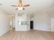 Spacious living room with abundant natural light, new flooring, and an open floor plan perfect for entertaining at 7939 Merchantville Cir, Zephyrhills, FL 33540