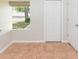 Window providing lots of natural light, tiled floors and neutral colors at 7939 Merchantville Cir, Zephyrhills, FL 33540