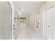 Inviting entryway with tile floors leading to a spacious living area with sliding glass doors to the exterior at 9395 Belvedere St, Spring Hill, FL 34608
