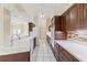 Stylish kitchen with modern appliances, custom cabinets, tile backsplash, and ample counter space at 9395 Belvedere St, Spring Hill, FL 34608