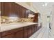 Well-equipped kitchen with custom cabinets, tile backsplash, and easy access to other living areas at 9395 Belvedere St, Spring Hill, FL 34608