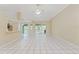 Spacious living room featuring a tile floor, natural light, and easy access to the kitchen at 9395 Belvedere St, Spring Hill, FL 34608