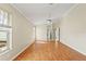 Bright living room with hardwood floors and large windows providing natural light at 9395 Belvedere St, Spring Hill, FL 34608