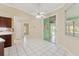 Dining room with tile floor and sliding glass door leading to outdoor patio at 9395 Belvedere St, Spring Hill, FL 34608