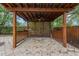 Covered brick patio with a ceiling fan and lattice privacy wall at 9395 Belvedere St, Spring Hill, FL 34608