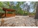 Expansive backyard patio with a charming wooden gazebo, perfect for outdoor entertaining at 9395 Belvedere St, Spring Hill, FL 34608