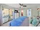 This bedroom has an attached bathroom, closet, and a sliding door to the outside at 10100 Sailwinds N Blvd # 203, Largo, FL 33773