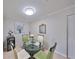 Cozy dining area with a glass table and modern chairs for comfortable dining at 10100 Sailwinds N Blvd # 203, Largo, FL 33773