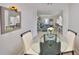 Open floor plan showing the dining area with view through to the living room and kitchen at 10100 Sailwinds N Blvd # 203, Largo, FL 33773