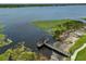 Aerial view of dock/fishing pier with water plants surrounding and clear skies at 10100 Sailwinds N Blvd # 203, Largo, FL 33773
