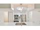 Modern kitchen featuring stainless steel appliances and sleek white cabinets at 10100 Sailwinds N Blvd # 203, Largo, FL 33773