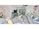 Bright living room with comfortable seating and sliding glass doors to a screened lanai at 10100 Sailwinds N Blvd # 203, Largo, FL 33773