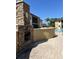 Outdoor poolside fireplace with community buildings and pool at 10100 Sailwinds N Blvd # 203, Largo, FL 33773