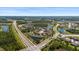 Expansive aerial shot showcasing the neighborhood's layout, including roads, ponds, and community homes at 10712 Pleasant Knoll Dr, Tampa, FL 33647