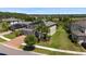 Expansive aerial view of a home with solar panels, brick driveway, and well-manicured landscaping at 10712 Pleasant Knoll Dr, Tampa, FL 33647