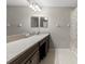 Bathroom featuring a long vanity, mirror, and a tub shower at 10712 Pleasant Knoll Dr, Tampa, FL 33647