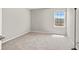 A minimalist bedroom with neutral walls and carpet flooring, ready for personalization at 10712 Pleasant Knoll Dr, Tampa, FL 33647