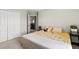 A cozy bedroom with plush bedding, a closet, and soft carpet flooring at 10712 Pleasant Knoll Dr, Tampa, FL 33647