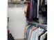 Spacious walk-in closet with ample storage and organization with clothing racks and shelving at 10712 Pleasant Knoll Dr, Tampa, FL 33647