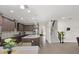 Modern kitchen with stainless steel appliances, granite countertops, and seamless flow to living areas at 10712 Pleasant Knoll Dr, Tampa, FL 33647