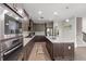 Modern kitchen with stainless steel appliances, granite countertops, and ample storage at 10712 Pleasant Knoll Dr, Tampa, FL 33647