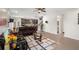 Bright open-concept living room with a kitchen, ceiling fan, and comfortable seating at 10712 Pleasant Knoll Dr, Tampa, FL 33647