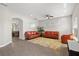Bright living room with tile floors, recessed lighting, ceiling fan, and two leather sofas at 10712 Pleasant Knoll Dr, Tampa, FL 33647