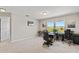 Bright loft area with natural light, ideal for a workspace or lounge area, featuring a view at 10712 Pleasant Knoll Dr, Tampa, FL 33647