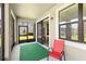 Enjoy the screened patio with a view of the green backyard and convenient access to the indoor dining space at 10712 Pleasant Knoll Dr, Tampa, FL 33647