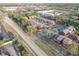 Aerial shot of red and gray townhomes, tree-lined streets and dedicated parking enhance this well-maintained property's appeal at 1095 82Nd N Ter # 1095A, St Petersburg, FL 33702