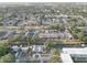 Aerial view of townhomes with lush trees and landscaping, highlighting well-maintained grounds, and ample parking spaces at 1095 82Nd N Ter # 1095A, St Petersburg, FL 33702