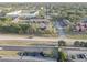 Aerial view of townhome community, highlighting parking, with mature trees and landscaping, offering a tranquil living environment at 1095 82Nd N Ter # 1095A, St Petersburg, FL 33702
