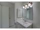Bright bathroom featuring a clean white vanity, a medicine cabinet, and a well-lit mirror at 1095 82Nd N Ter # 1095A, St Petersburg, FL 33702