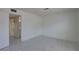 Clean bedroom with new tile floors and an open door to the bathroom at 1095 82Nd N Ter # 1095A, St Petersburg, FL 33702