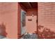 Exterior view of a condo entrance featuring red brick, individual mailboxes, and a screen door at 1095 82Nd N Ter # 1095A, St Petersburg, FL 33702