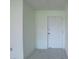 Light and airy foyer with tile flooring, neutral paint, and a white door at 1095 82Nd N Ter # 1095A, St Petersburg, FL 33702