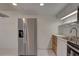 A kitchen with a stainless steel refrigerator, cabinets, a sink, and an oven at 1095 82Nd N Ter # 1095A, St Petersburg, FL 33702